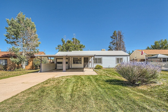 single story home with a front lawn and a carport