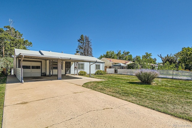 single story home featuring a front lawn and a garage