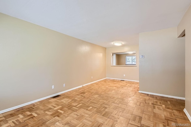 empty room with light parquet floors