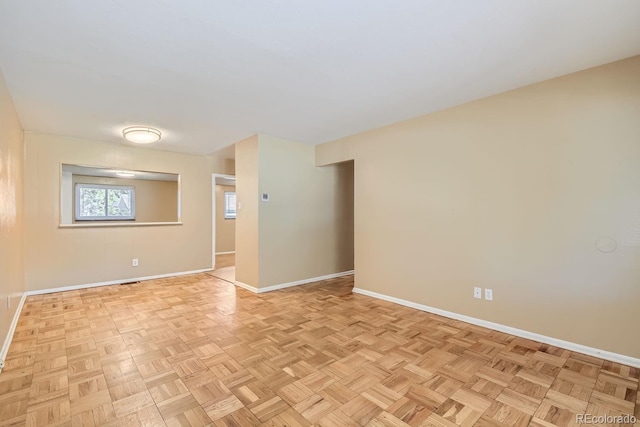 empty room with light parquet flooring