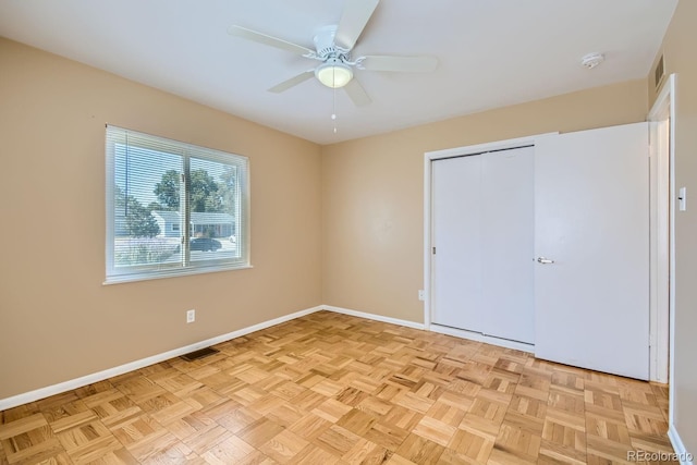 unfurnished bedroom featuring ceiling fan and light parquet floors