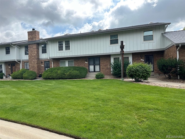 10320 E Jewell Ave Unit 63, Aurora, CO 80247 - multi unit property with a chimney, brick siding, and a front lawn