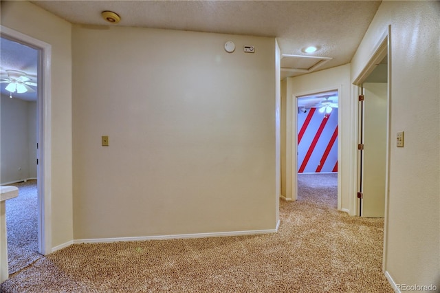 10320 E Jewell Ave Unit 63, Aurora, CO 80247 - corridor featuring carpet floors, a textured ceiling, and baseboards