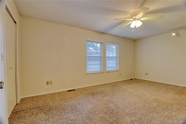 10320 E Jewell Ave Unit 63, Aurora, CO 80247 - carpeted spare room with a textured ceiling, ceiling fan, and baseboards