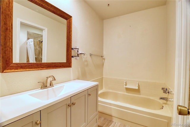 10320 E Jewell Ave Unit 63, Aurora, CO 80247 - bathroom featuring a garden tub and vanity