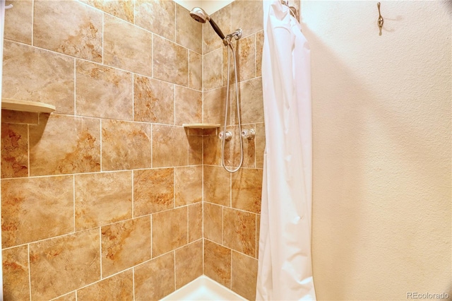 10320 E Jewell Ave Unit 63, Aurora, CO 80247 - bathroom featuring a tile shower