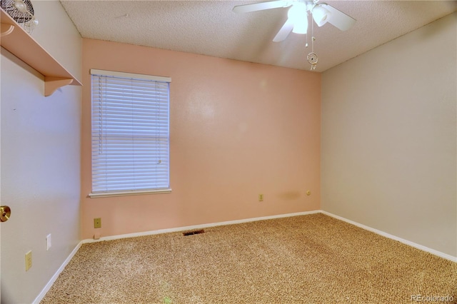 10320 E Jewell Ave Unit 63, Aurora, CO 80247 - spare room featuring carpet, ceiling fan, a textured ceiling, and baseboards