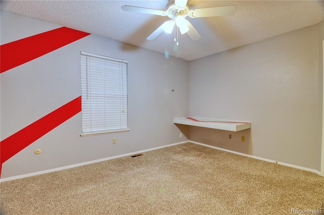 10320 E Jewell Ave Unit 63, Aurora, CO 80247 - carpeted spare room with a ceiling fan, a textured ceiling, and baseboards