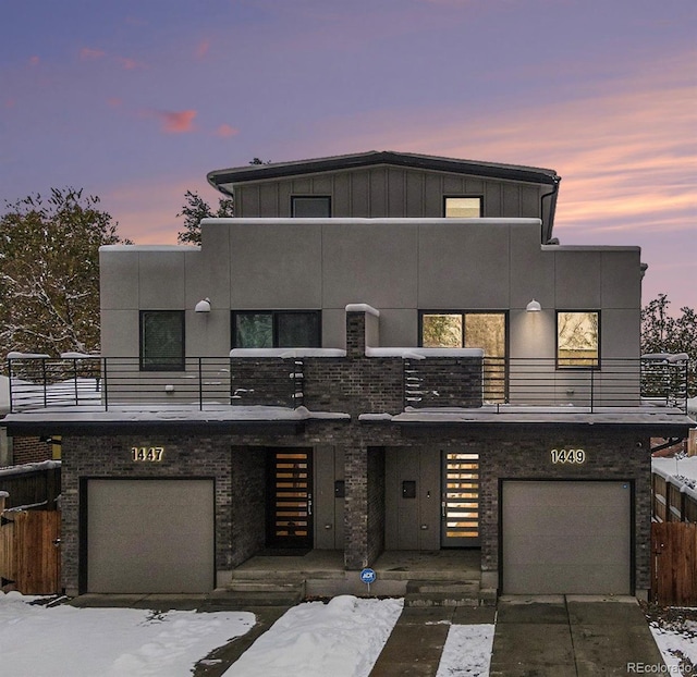 contemporary home with a balcony and a garage