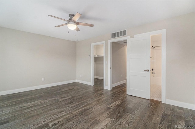 unfurnished room featuring dark hardwood / wood-style flooring and ceiling fan