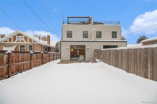 view of snow covered property