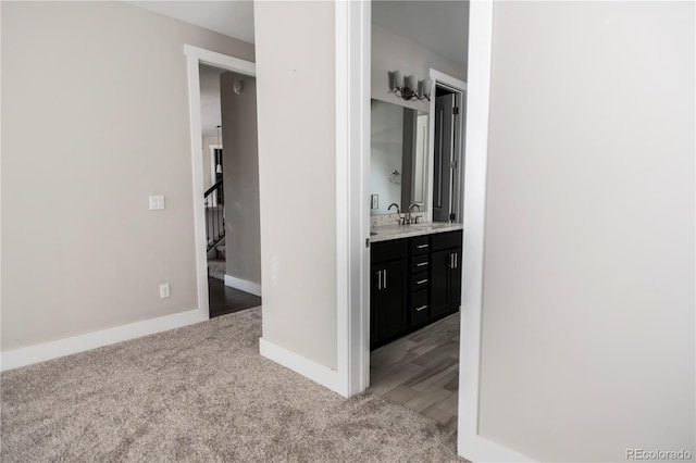 bathroom with vanity and baseboards