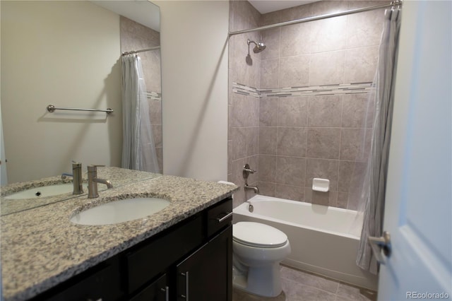 bathroom featuring tile patterned floors, vanity, toilet, and shower / tub combo with curtain