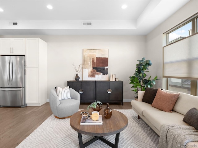 living room with light hardwood / wood-style flooring