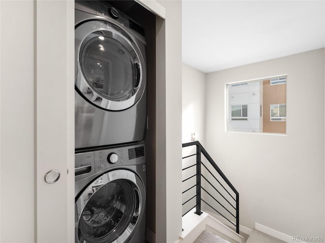 laundry area with stacked washer and dryer