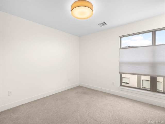 empty room with carpet flooring