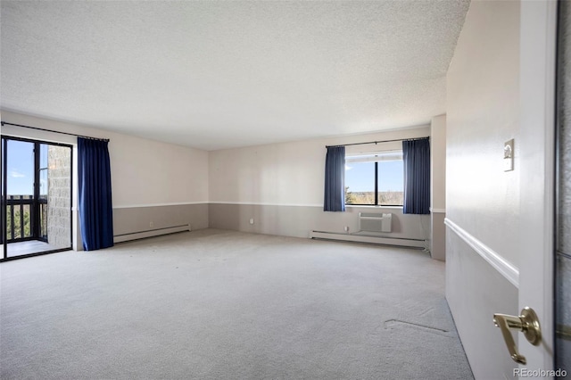 carpeted empty room featuring a healthy amount of sunlight, a baseboard heating unit, and a textured ceiling
