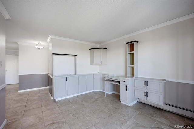 unfurnished office featuring ornamental molding, a textured ceiling, and baseboards