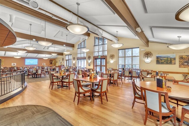 dining space with wood finished floors