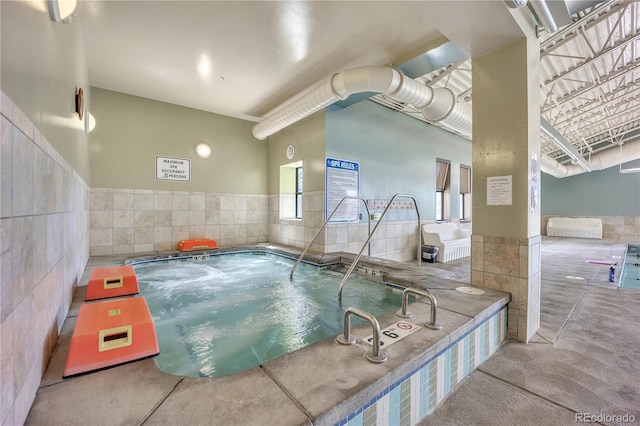 view of pool featuring an indoor in ground hot tub and a pool