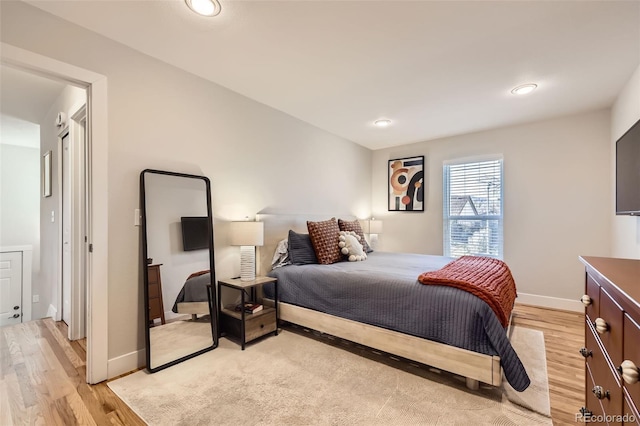 bedroom with light hardwood / wood-style floors