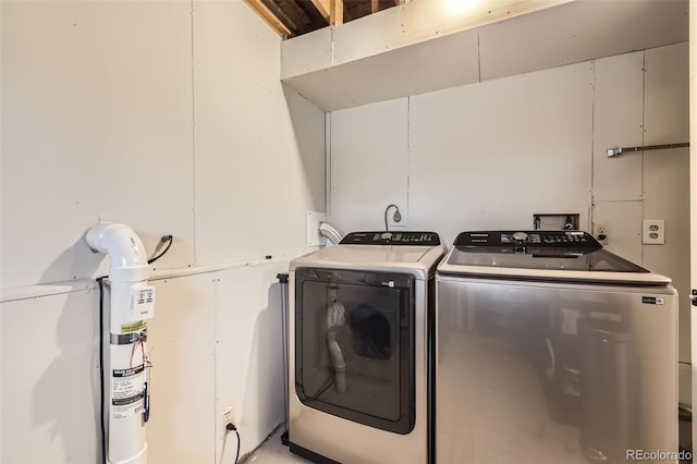 laundry room featuring separate washer and dryer