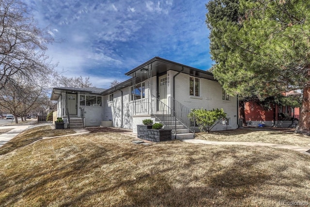 view of home's exterior featuring brick siding