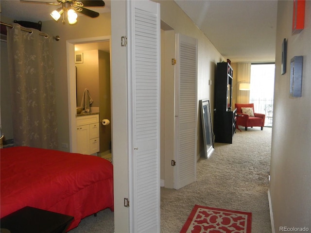 bedroom featuring ceiling fan and light carpet