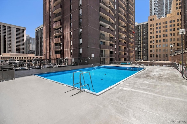 view of swimming pool featuring a patio area