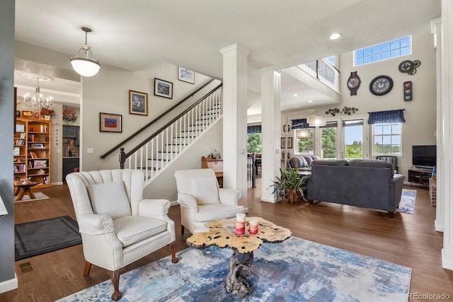 3973 Palmer Ridge Dr, Parker, CO 80134 - living area with plenty of natural light, wood finished floors, and a high ceiling