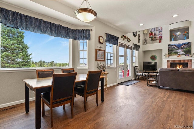 3973 Palmer Ridge Dr, Parker, CO 80134 - dining area featuring wood finished floors, recessed lighting, a fireplace, and built in shelves