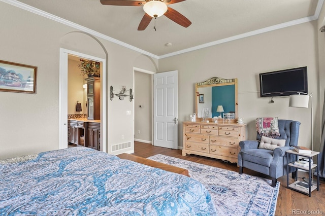 3973 Palmer Ridge Dr, Parker, CO 80134 - bedroom featuring wood finished floors, crown molding, ensuite bath, and ceiling fan