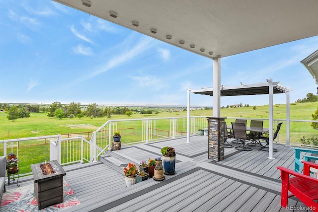 3973 Palmer Ridge Dr, Parker, CO 80134 - deck with outdoor dining area, a fire pit, a yard, and a view of rural / pastoral area