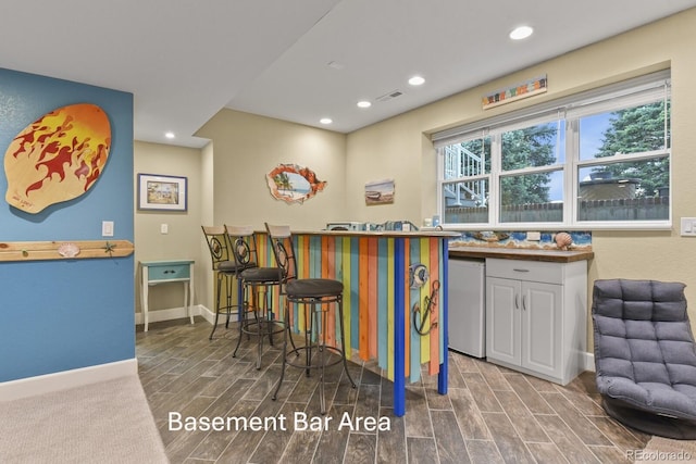 3973 Palmer Ridge Dr, Parker, CO 80134 - bar featuring recessed lighting, wood tiled floors, and fridge