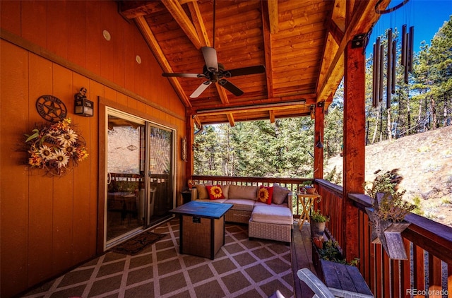 sunroom / solarium featuring wood ceiling, ceiling fan, and vaulted ceiling with beams