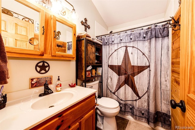 bathroom featuring a shower with curtain, lofted ceiling, vanity, and toilet