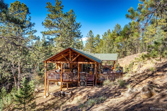 view of front of house with a wooden deck