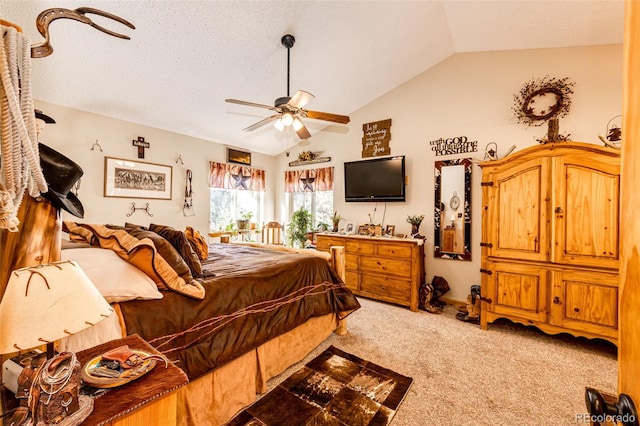 bedroom with ceiling fan, lofted ceiling, and carpet