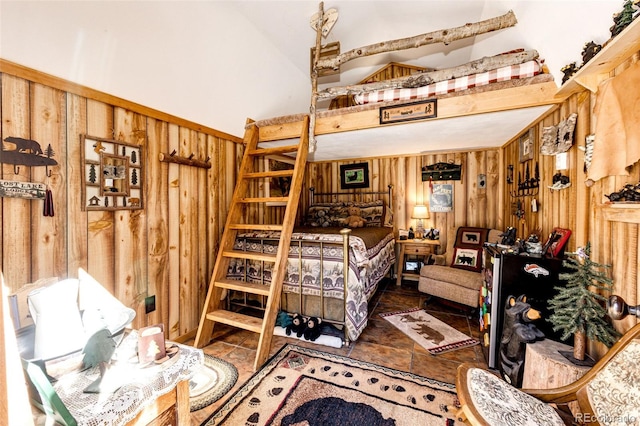 bedroom with wood walls