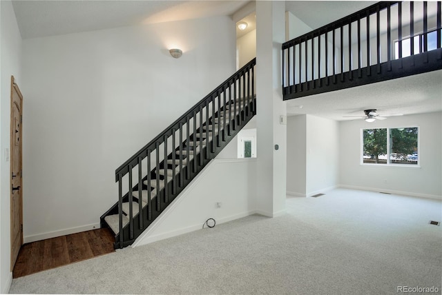 5163 E 123rd Ct, Thornton, CO 80241 - stairs featuring carpet flooring, ceiling fan, and a towering ceiling