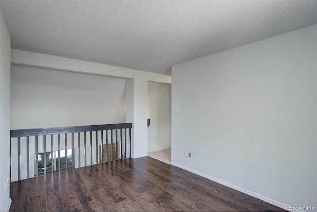 5163 E 123rd Ct, Thornton, CO 80241 - spare room with wood finished floors and a textured ceiling