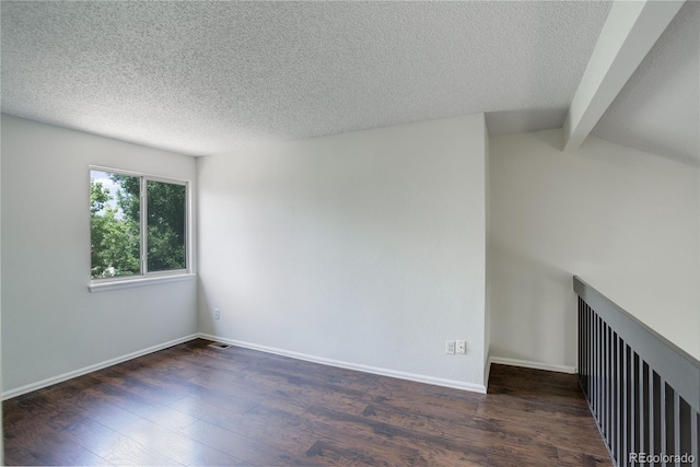 5163 E 123rd Ct, Thornton, CO 80241 - unfurnished room featuring wood finished floors, beamed ceiling, and a textured ceiling