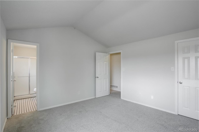 5163 E 123rd Ct, Thornton, CO 80241 - unfurnished bedroom featuring carpet floors, lofted ceiling, and ensuite bathroom