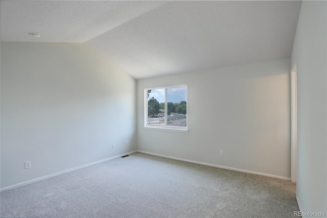 5163 E 123rd Ct, Thornton, CO 80241 - empty room featuring carpet flooring, lofted ceiling, and a textured ceiling