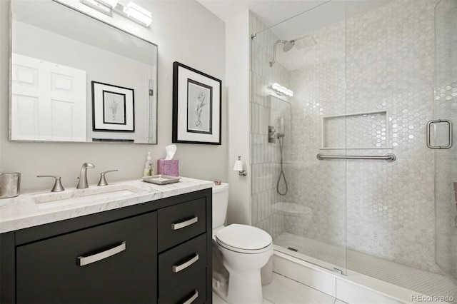 bathroom featuring vanity, toilet, and walk in shower