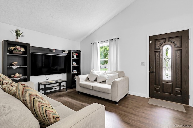 17499 E Whitaker Dr, Aurora, CO 80015 - living area with wood finished floors, high vaulted ceiling, and baseboards