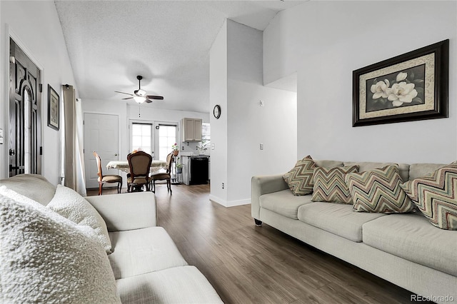17499 E Whitaker Dr, Aurora, CO 80015 - living area with a ceiling fan, dark wood-style floors, and baseboards