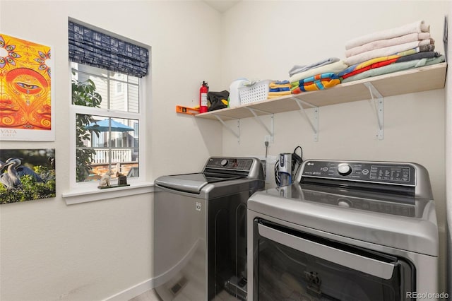 laundry room with washing machine and clothes dryer