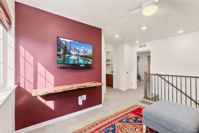 hallway with light colored carpet