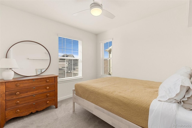 bedroom with light colored carpet and ceiling fan